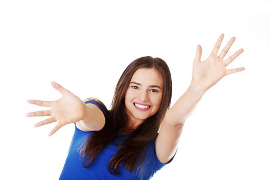 Young beautiful casual woman with palms in front. Isolated on white.