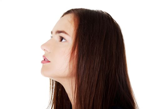 Profile of beautiful woman looking up. Isoalted on white.