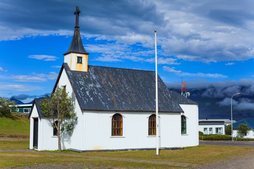 Typical Rural Icelandic Church under a blue summer sky. Horizontal shot