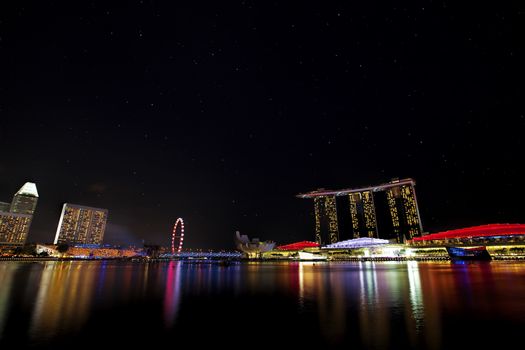 View of Singapore city skyline at night with starry sky