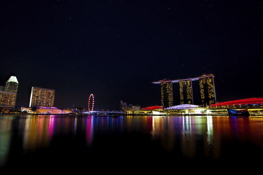 View of Singapore city skyline at night with starry sky