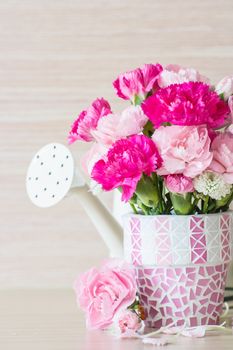 Carnation in mosaic flower pot