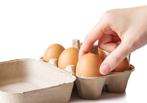 Woman hands with eggs on white background