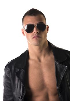 Attractive young man shirtless, wearing black leather trench on naked chest. With sunglasses