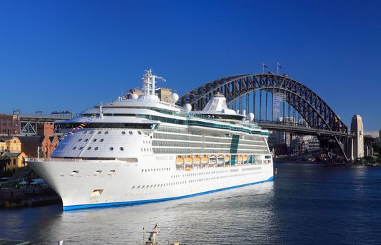 Sydney, Australia - December 1, 2013; Royal Caribbean Cruises Radiance of the Seas looking radiant in Sydney Harbour Circular Quay, Harbour Bridge in background.