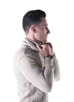 Profile shot of handsome young man with wool sweater isolated on white background