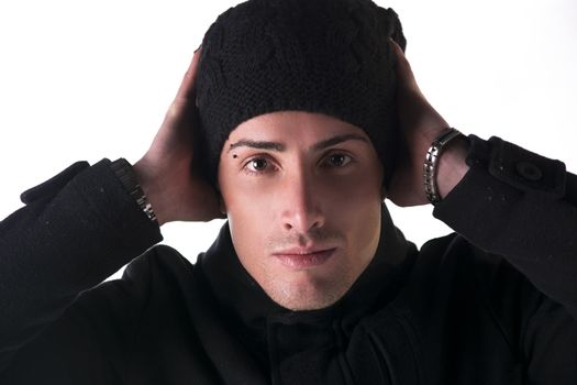 Headshot of young man with wool hat and winter coat, isolated on white