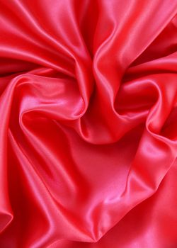 Red heart from elegant red silk for St Valentine's day background 