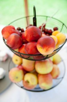 Basket full with fresh Apples and Peaches