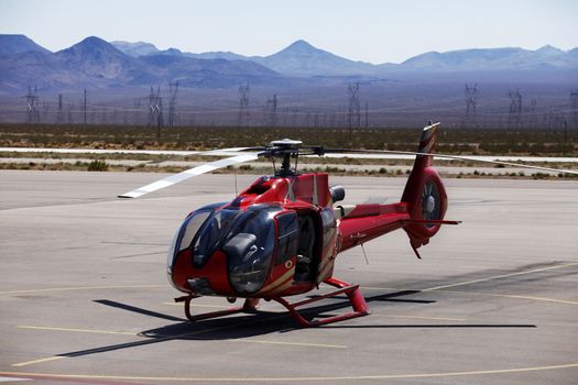 Helicopter starting from restricted fenced base near Grand Canyon