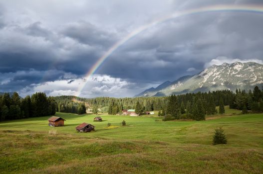 rainbow over Karwendel mountain range in Bavarian Alps, Germany