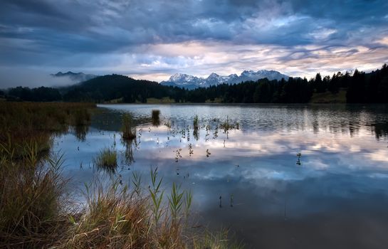clouded sunrise over Geroldsee in Bavarian Alps, Germany