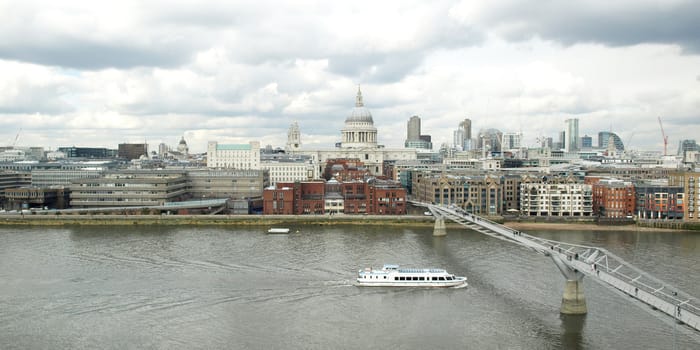 Wide angle view of Saint Paul's Cathedral in the City of London, UK under a typica British rainy weather