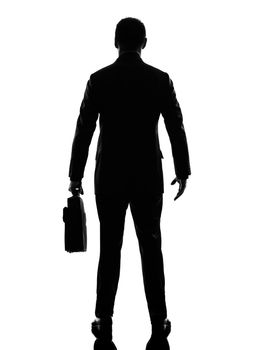 one caucasian business man rear view back in silhouette  on white background