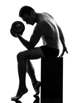 one caucasian man exercising body building in silhouette on white background