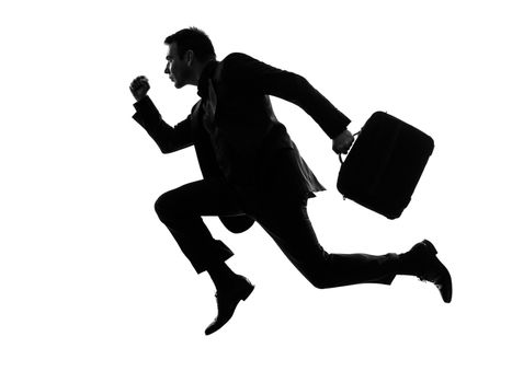 one caucasian business man running in silhouette  on white background