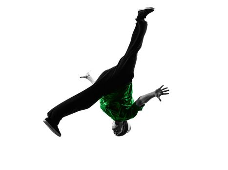 one caucasian young acrobatic break dancer breakdancing man in silhouette  white background