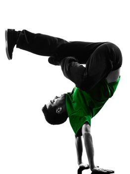 one caucasian young acrobatic break dancer breakdancing man in silhouette  white background