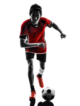 one asian soccer player young man dribbling in silhouette isolated white background