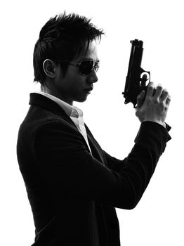 one asian gunman killer portrait  in silhouette isolated white background