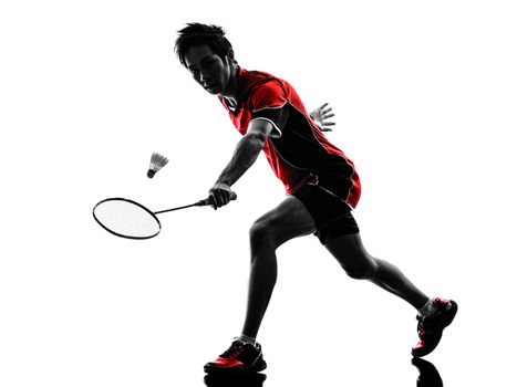 one asian badminton player young man  in silhouette isolated white background