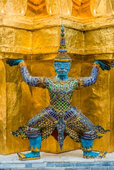 yaksha demon supporting golden chedi grand palace bangkok thailand
