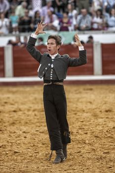 Pozoblanco, Cordoba province, SPAIN- 25 september 2011: Spanish bullfighter on horseback Leonardo Hernandez  bullfighting on horsebackin a gesture of satisfaction and triumph when you just kill the bullin Pozoblanco, Cordoba province, Andalusia, Spain