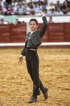 Pozoblanco, Cordoba province, SPAIN- 25 september 2011: Spanish bullfighter on horseback Leonardo Hernandez  bullfighting on horsebackin a gesture of satisfaction and triumph when you just kill the bullin Pozoblanco, Cordoba province, Andalusia, Spain