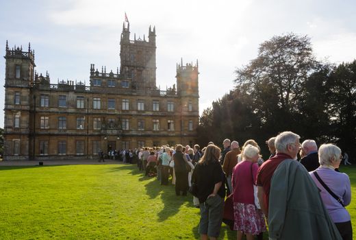 NEWBURY, UK - CIRCA OCTOBER 2011: People  queuing to visit Highclere Castle which  is the main setting for the ITV period drama Downton Abbey.