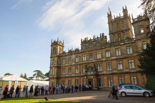 NEWBURY, UK - CIRCA OCTOBER 2011: People  queuing to visit Highclere Castle which  is the main setting for the ITV period drama Downton Abbey.