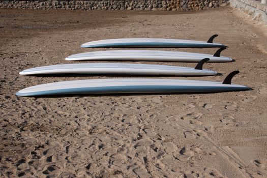 Surf Boards on the beach waiting to be used.
