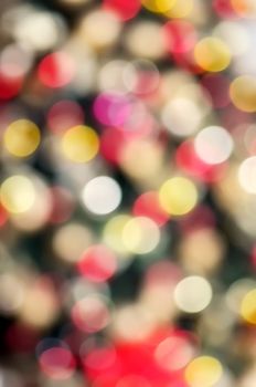 Colorful bokeh of Christmas lights on Christmas tree