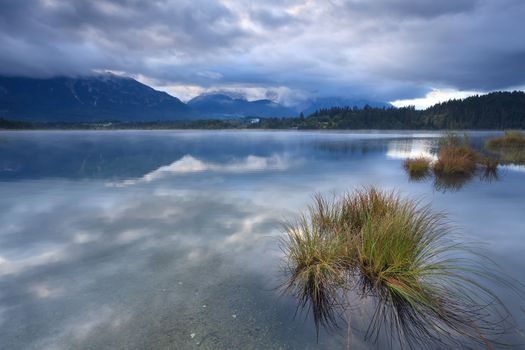 clouded dusk over Barmsee lake with view on Karwendel mountains, Bavaria, Germany