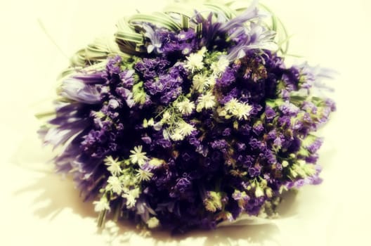 Close-up of wedding bouquet made of white and violet flowers