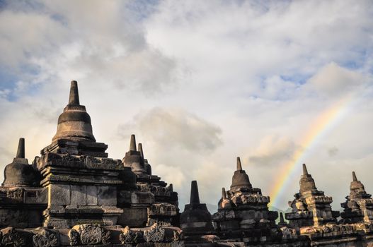 Rainbow over Stupa Buddist temple Borobudur complex in Yogjakarta in Java, indonesia