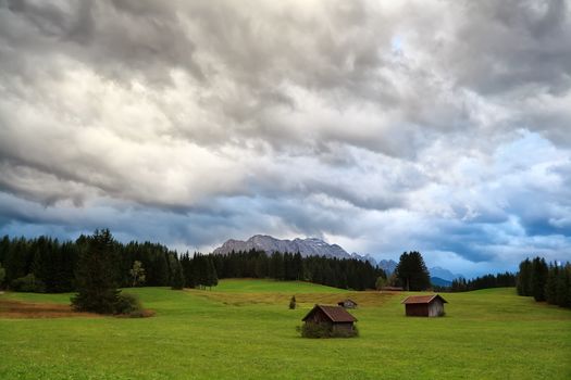 rainy clouded sky over alpine meadows, Bavaria, Germany