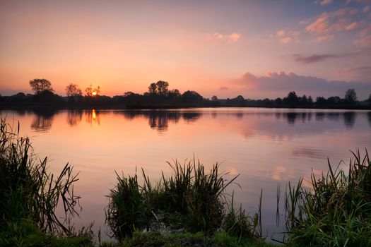 calm autumn sunrise over wild lake, Drenthe, Netherlands