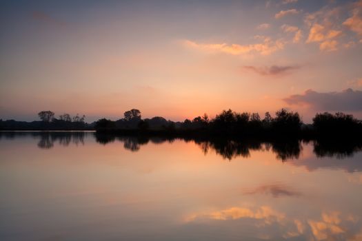 warm gold sunrise over wild lake, Drenthe, Netherlands