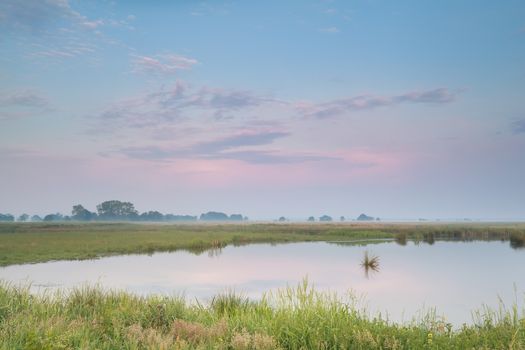 pastel summer sunrise over river, Onlanden, Drenthe, Netherlands