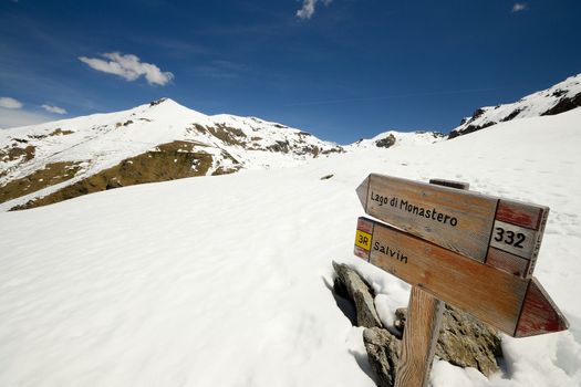 Footpath's signposts in scenic high mountain landscape, italian Alps
