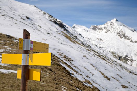 Footpath's signposts in scenic high mountain landscape, italian Alps