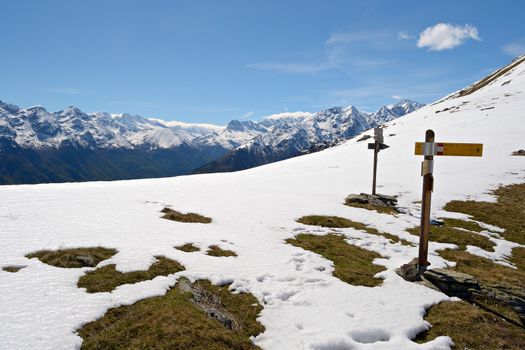 Footpath's signposts in scenic high mountain landscape, italian Alps