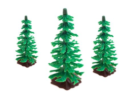 Toy fir trees isolated against a white background