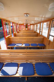 ST. WOLFGANG, AUSTRIA - AUGUST 6: Steam train inside car pasenger benches going to Schafberg Peak (1783m) on August 6, 2013 in St. Wolfgang.
