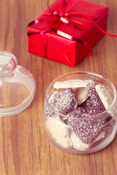 Heart shaped cookies in a bank near the gift