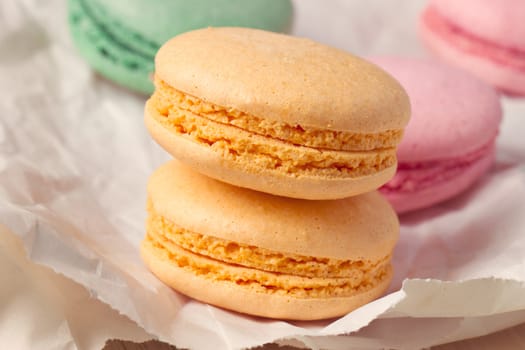 Multicolored macaroon on parchment paper