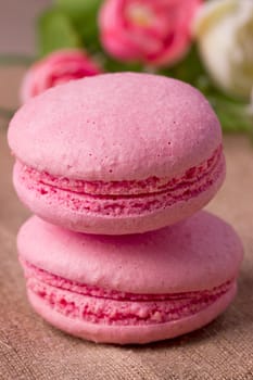 Pink macaroon with raspberry flavor on sacking