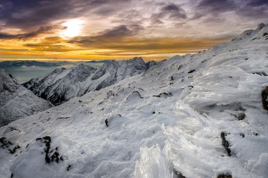 Winter mountains with frozen snow and icing at sunset, High Tatras, Slovakia