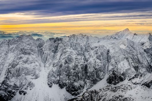 Scenic view of white winter mountains with colorful sunset, High Tatras, Slovakia