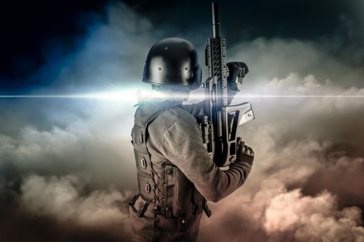 Soldier in uniform with rifle, assault sniper on apocalyptic clouds, firing